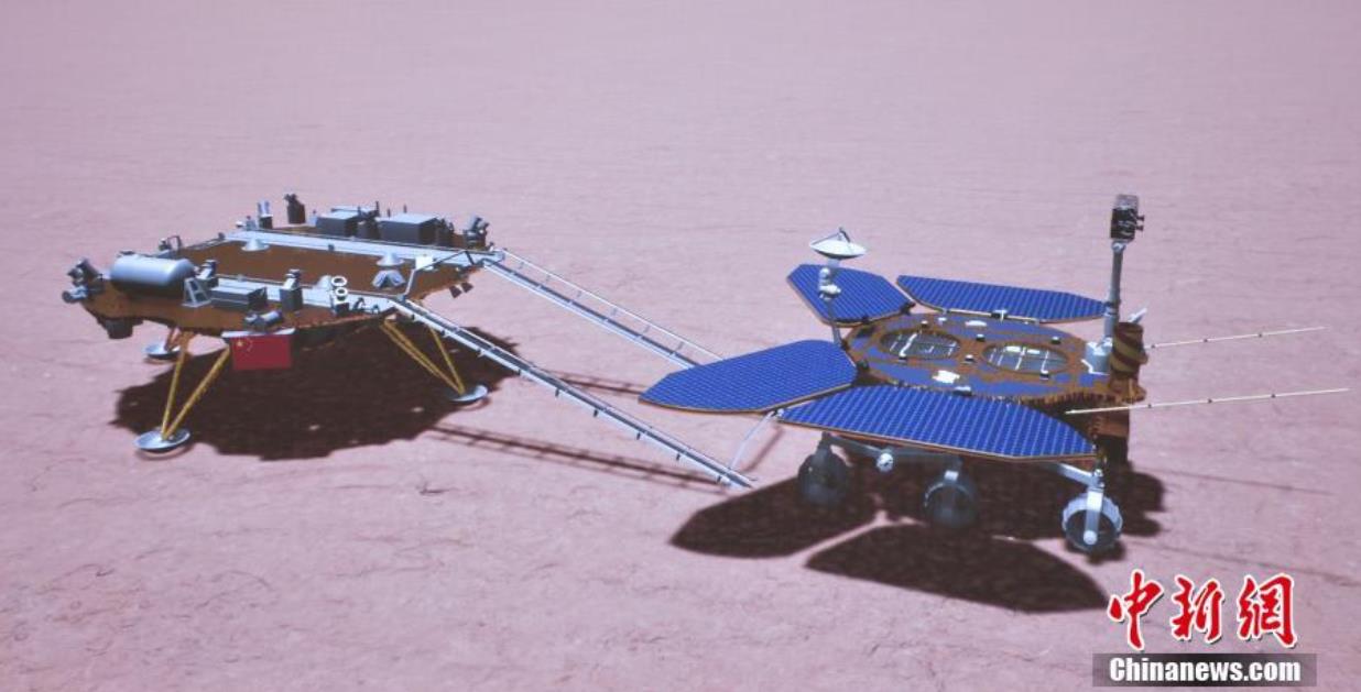 图为“祝融号”火星车驶上火星表面模拟图像
