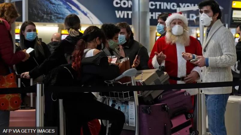 queue in the departures hall at London's Heathrow airport